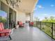 Spacious balcony with comfortable seating and views of the surrounding greenery and blue skies at 14850 E Grandview Dr # 204, Fountain Hills, AZ 85268