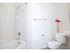 Simple bathroom featuring a tub and shower combination, toilet, and pedestal sink at 14850 E Grandview Dr # 204, Fountain Hills, AZ 85268
