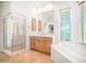 Bathroom with a walk-in shower, soaking tub, wood cabinet vanity, and tile flooring at 14850 E Grandview Dr # 204, Fountain Hills, AZ 85268