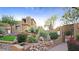 Southwest home featuring desert landscaping, private walkway, and entry gate at 14850 E Grandview Dr # 204, Fountain Hills, AZ 85268