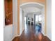 View of the hallway leading to the dining room with hardwood flooring and a decorative nook at 14850 E Grandview Dr # 204, Fountain Hills, AZ 85268