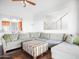 Spacious living room featuring a sectional sofa and bright, natural light at 14850 E Grandview Dr # 204, Fountain Hills, AZ 85268