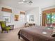 Bright main bedroom featuring neutral decor, a ceiling fan, and a private balcony at 14850 E Grandview Dr # 204, Fountain Hills, AZ 85268