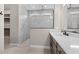 Elegant bathroom featuring a single sink vanity, sleek countertops, and a glass-enclosed tile shower at 22762 E Stacey Rd, Queen Creek, AZ 85142