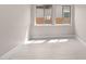 Bright bedroom with light wood flooring and a view to the exterior at 22762 E Stacey Rd, Queen Creek, AZ 85142