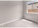 Well-lit bedroom featuring light-colored walls and floor with a view to the exterior at 22762 E Stacey Rd, Queen Creek, AZ 85142