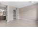 Bright main bedroom featuring tile floors, recessed lighting, and an ensuite bathroom at 22762 E Stacey Rd, Queen Creek, AZ 85142