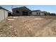 New home construction with scaffolding in a large backyard of a new development community at 2328 E Spur Dr, San Tan Valley, AZ 85140