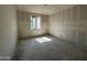 A bedroom with a window allowing natural sunlight to stream in at 2328 E Spur Dr, San Tan Valley, AZ 85140
