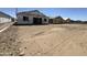 A new home under construction, shown with building materials, in a neighborhood at 2328 E Spur Dr, San Tan Valley, AZ 85140