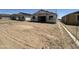 A new home community with houses under construction in a large vacant lot at 2328 E Spur Dr, San Tan Valley, AZ 85140