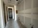 Hallway with open doorway, hookups, and gray walls at 2328 E Spur Dr, San Tan Valley, AZ 85140