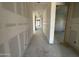 Spacious hallway with white walls leading to a bright, open living area at 2328 E Spur Dr, San Tan Valley, AZ 85140