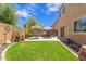 A grass backyard featuring a patio area and outdoor seating at 2565 E Southern Ave # 130, Mesa, AZ 85204
