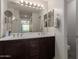 Spacious bathroom featuring double sinks, a large mirror, and modern fixtures at 2565 E Southern Ave # 130, Mesa, AZ 85204