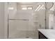 Bright bathroom showcasing a glass-enclosed shower and tub combination with modern fixtures at 2565 E Southern Ave # 130, Mesa, AZ 85204