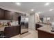 Modern kitchen with stainless steel appliances, dark cabinets, and ample counter space at 2565 E Southern Ave # 130, Mesa, AZ 85204