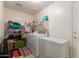 Functional laundry room with washer, dryer, freezer and ample storage space at 2565 E Southern Ave # 130, Mesa, AZ 85204