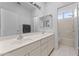 Bright bathroom featuring double sinks, a soaking tub and shower, and tiled floors at 2821 E Pontiac Dr, Phoenix, AZ 85050