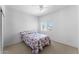 Bedroom features carpet, a ceiling fan, a window with blinds, and an electrical outlet at 2821 E Pontiac Dr, Phoenix, AZ 85050