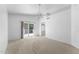 Large bedroom with carpet, ceiling fan, and private balcony at 2821 E Pontiac Dr, Phoenix, AZ 85050