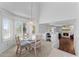 Inviting dining area with large windows, stylish chairs, and an elegant chandelier at 2821 E Pontiac Dr, Phoenix, AZ 85050