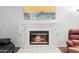 Elegant fireplace with white tile surround and mantel in a cozy living space at 2821 E Pontiac Dr, Phoenix, AZ 85050