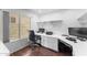 Bright home office with built-in desk, drawers, and views to the outside at 2821 E Pontiac Dr, Phoenix, AZ 85050