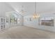 Bright and airy living room with high ceilings, large windows, and a chandelier at 2821 E Pontiac Dr, Phoenix, AZ 85050