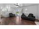 Spacious living room boasts wood floors, leather seating, and backyard access at 2821 E Pontiac Dr, Phoenix, AZ 85050