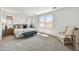 Serene main bedroom with plush carpeting, natural light, and stylish furnishings at 31345 N 130Th Ave, Peoria, AZ 85383
