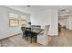 Cozy dining area with a rustic table, modern chairs, and ample natural light at 31345 N 130Th Ave, Peoria, AZ 85383