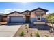 Charming single-Gathering home with a two-car garage and low-maintenance landscaping at 31345 N 130Th Ave, Peoria, AZ 85383