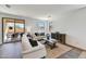 Bright and airy living room featuring a sliding glass door with access to outdoor seating at 31345 N 130Th Ave, Peoria, AZ 85383
