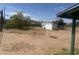 Large, empty backyard with a small storage shed at 3155 E Mobile Ln, Phoenix, AZ 85040