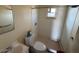 Small bathroom featuring a toilet, sink, and shower with a handheld showerhead at 3155 E Mobile Ln, Phoenix, AZ 85040