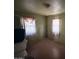 Sparse bedroom with brick walls and a small window at 3155 E Mobile Ln, Phoenix, AZ 85040