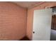 Brick walled interior corner showing an interior door at 3155 E Mobile Ln, Phoenix, AZ 85040