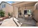 Charming covered patio with stylish furniture and a relaxing hammock, perfect for outdoor living and entertaining at 3502 E Rockwood Dr, Phoenix, AZ 85050
