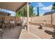 Inviting covered patio featuring comfortable seating and a cozy hammock for relaxing outdoors at 3502 E Rockwood Dr, Phoenix, AZ 85050