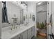 Bright bathroom with double sinks, quartz countertops, and modern decor at 4300 S Marble St, Gilbert, AZ 85297