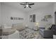 Bedroom with baby crib, changing table, and comfortable armchair at 4300 S Marble St, Gilbert, AZ 85297