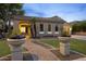 Charming home with a walkway, manicured lawn, mature landscaping, and exterior lighting at 4300 S Marble St, Gilbert, AZ 85297