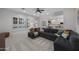 Bright living room featuring modern furniture, and light colored carpet at 4300 S Marble St, Gilbert, AZ 85297