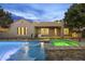 Beautiful backyard pool and spa featuring color lighting, fountains, and a resort-style lounge at 4300 S Marble St, Gilbert, AZ 85297
