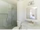 This pristine bathroom features a glass shower and classic marble vanity at 5328 E Yale St, Phoenix, AZ 85008