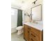 This neutral bathroom offers a shower/tub combo and a rich wood vanity at 5328 E Yale St, Phoenix, AZ 85008