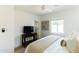 Bright bedroom features a neutral palette, dark wood accents, and soft natural light at 5328 E Yale St, Phoenix, AZ 85008