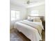 Inviting bedroom with a large bed, soft bedding, and natural light at 5328 E Yale St, Phoenix, AZ 85008