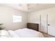 Bright bedroom features a neutral palette, light wood accents, and soft natural light at 5328 E Yale St, Phoenix, AZ 85008